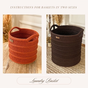 May include: Two crocheted laundry baskets, one orange and one brown, with handles. The baskets are sitting on a wooden surface and a woven rug.