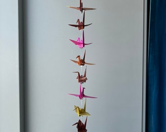 A string of 10 origami cranes - mixed patterns and colors