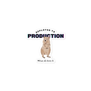 May include: A sticker with a quokka, a small marsupial native to Rottnest Island, Australia. The sticker features the text "Deployed to Production" and the phrase "We've all done it."