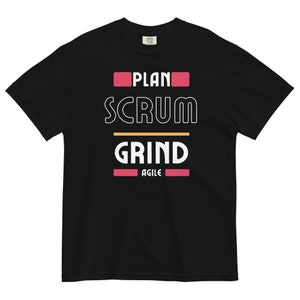 May include: Black t-shirt with white text that reads "PLAN SCRUM GRIND AGILE" in a bold, blocky font. The words "PLAN" and "AGILE" are in pink.