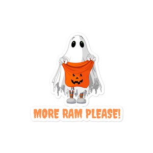 May include: A cartoon ghost wearing a white sheet and holding a trick-or-treat bag with a jack-o'-lantern face. The text "MORE RAM PLEASE!" is below the ghost.