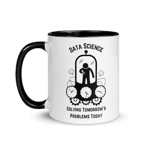 May include: White ceramic mug with a black rim and handle. The mug features a black and white illustration of a person inside a time machine with the text "Data Science Solving Tomorrow's Problems Today."