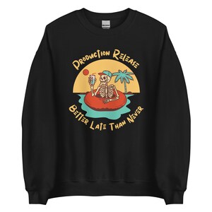 May include: Black sweatshirt with a graphic of a skeleton in a life preserver on a beach with the text "Production Release Better Late Than Never".