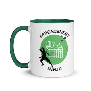 May include: White ceramic mug with a green rim and handle. The mug features a green circle with a spreadsheet icon, a pie chart, and a line graph. The text "SPREADSHEET NINJA" is printed on the mug.