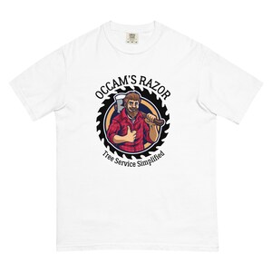 May include: White t-shirt with a black and white logo featuring a cartoon lumberjack holding an axe. The logo says "Occam's Razor Tree Service Simplified".