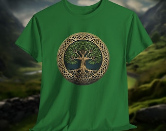 May include: Green t-shirt featuring a detailed illustration of a tree within a gold Celtic knot circle. The tree has green leaves and brown roots, set against a green background. The shirt is a short-sleeved crew neck.
