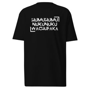 May include: Black t-shirt with white text that reads "HUMUHUMU NUKUNUKU WACHUFAKA"
