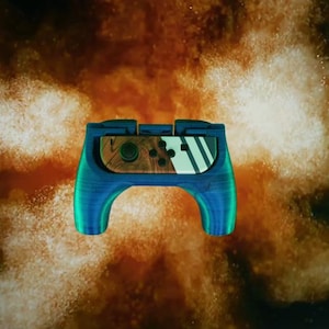 May include: A blue and green custom controller for the Nintendo Switch with a wood grain design on the front.