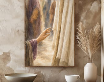 May include: A framed print depicting a religious scene. A hand reaches out towards a draped cloth. The artwork features muted tones of beige, purple, and brown, creating a serene and contemplative atmosphere. The image is framed in a wooden frame.