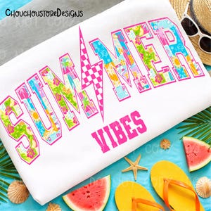 May include: White beach towel with the words "SUMMER VIBES" in pink. The word "SUMMER" is filled with colorful tropical patterns and outlined in pink. The towel is surrounded by summer accessories, including watermelon slices and flip-flops.