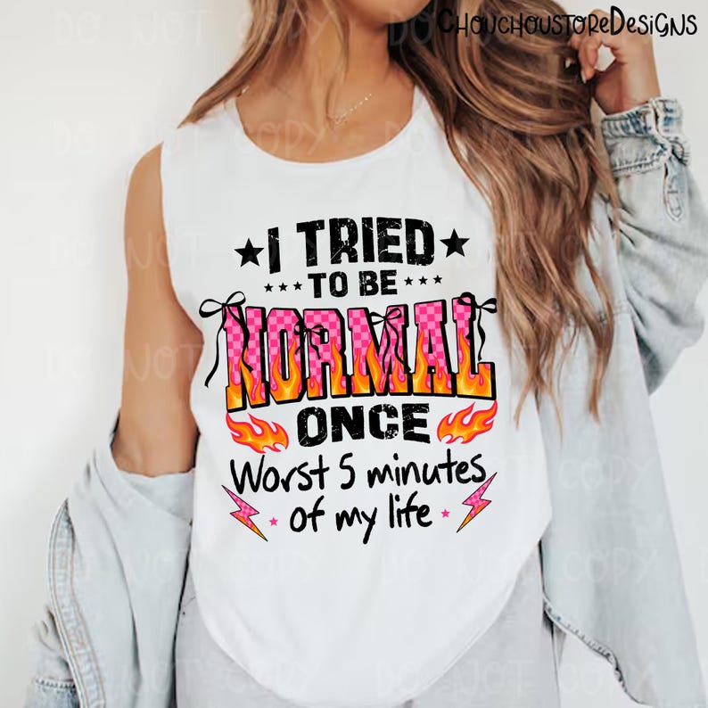 May include: White sleeveless shirt with the text "I TRIED TO BE NORMAL ONCE Worst 5 minutes of my life" in black, pink, orange, and yellow. The shirt has a graphic design with stars, flames, and lightning bolts.
