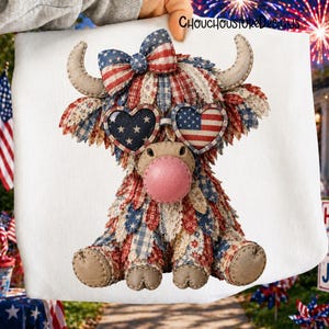 May include: A plush Highland cow with patriotic red, white, and blue patchwork fabric. It features heart-shaped sunglasses with American flags and a bow. The cow has tan horns, hooves, and a pink nose. The text "ChouChouStoreDesigns" is visible.