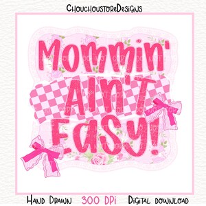 May include: Pink digital design with the text "Mommin' Ain't Easy!" in a bold, playful font. The design includes a checkered pattern, floral accents, and decorative bows. The words "Hand Drawn" and "Digital Download" are also included.