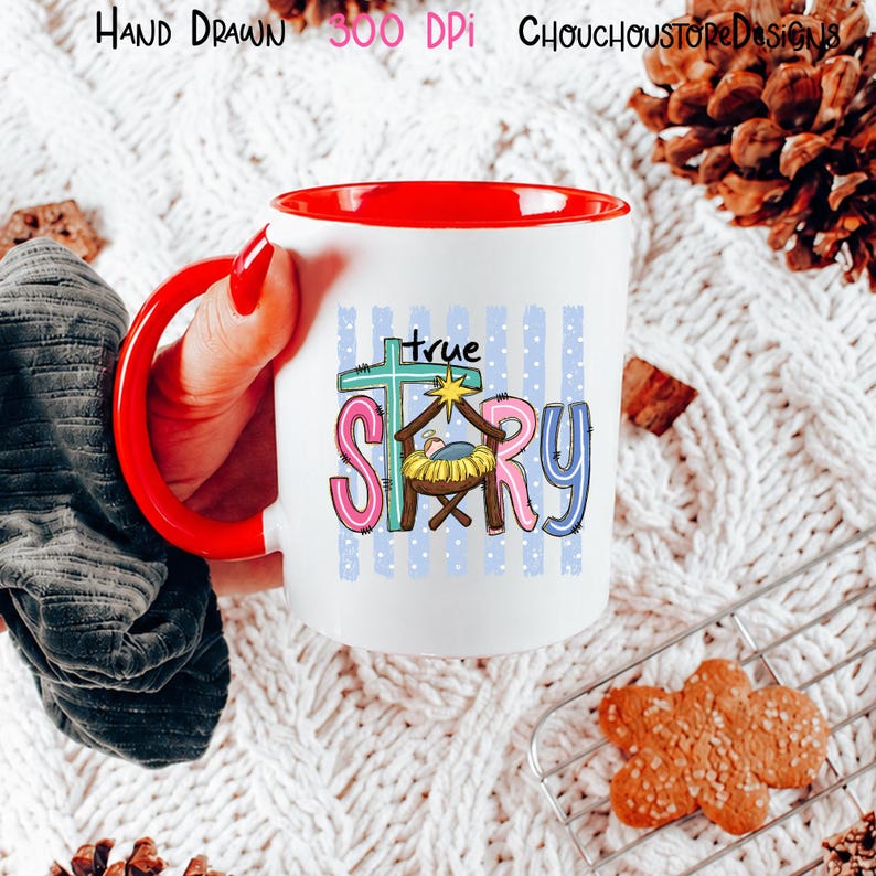 May include: A white ceramic mug with a bright red handle and interior. The mug features a colorful graphic with the text "true story" and a nativity scene illustration including a manger, a star, and a cross against a blue polka dot background.