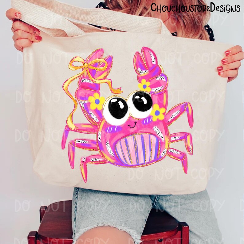 May include: A beige tote bag featuring a cartoon crab design. The crab is pink with yellow accents, large black eyes, and a smiling face. The crab has yellow flowers and a yellow bow. The tote bag has the text "DO NOT COPY" repeated.