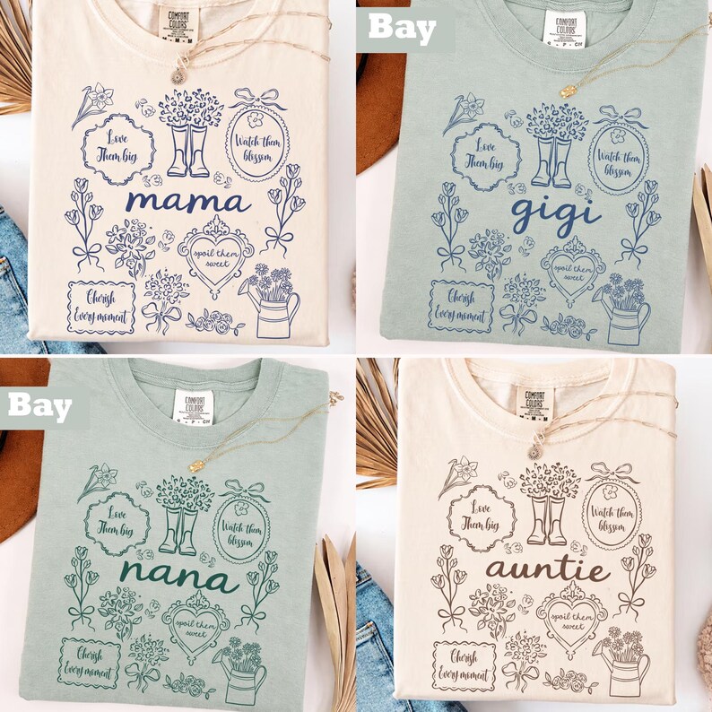May include: Comfort Colors t-shirts in cream, bay, and sage green. Each shirt features a floral design with the words "mama", "gigi", "nana", and "auntie". The design includes boots, hearts, and the phrases "Love them big", "Watch them blossom", and "Cherish every moment".