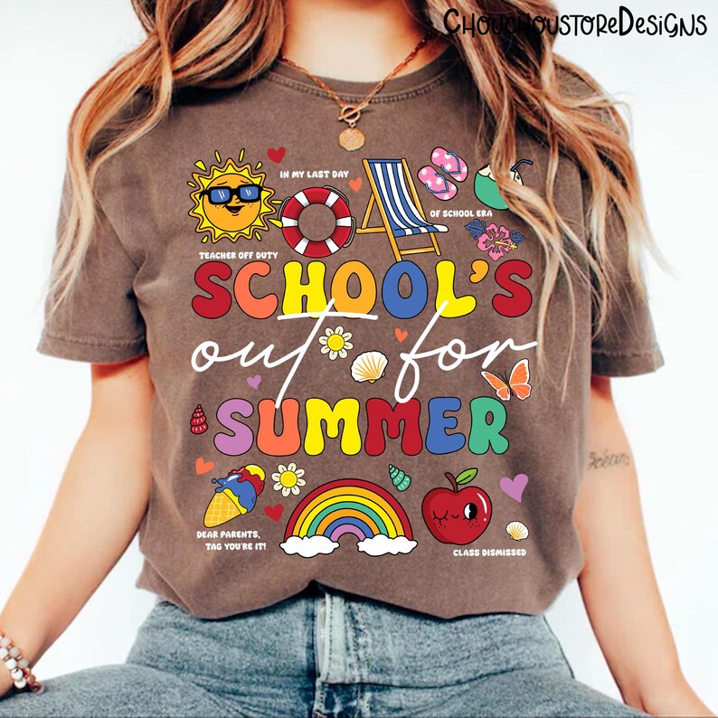 May include: A brown t-shirt with the text "SCHOOL'S out for SUMMER" in colorful letters. The shirt features various summer-themed graphics, including a sun, a rainbow, an apple, and a beach chair. The phrase "Teacher Off Duty" is also included.