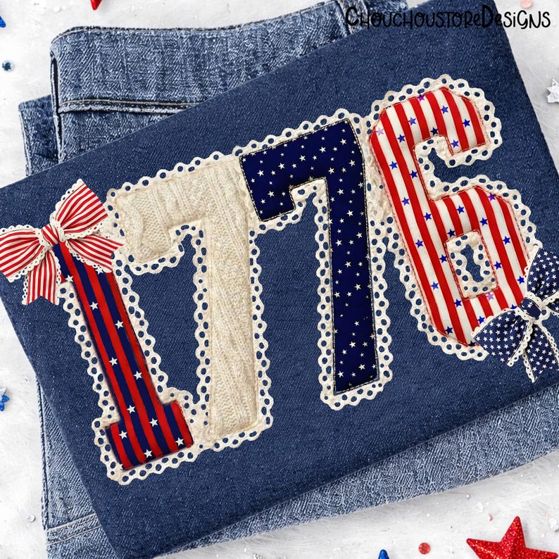 May include: A denim blue fabric with the number "1776" appliqued in red, white, and blue patriotic patterns. The numbers are outlined with white lace trim. A red, white, and blue bow is on the left and a blue bow on the right.