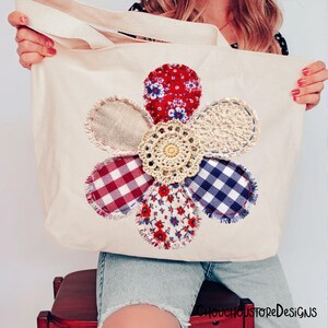 May include: Cream-coloured tote bag featuring a large, colourful flower appliqu&eacute;. The flower petals are made from various fabrics, including red floral, gingham, and crochet. The bag has cream-coloured handles and the text "CHOUCHOUSTOREDeSiGNS" is visible.