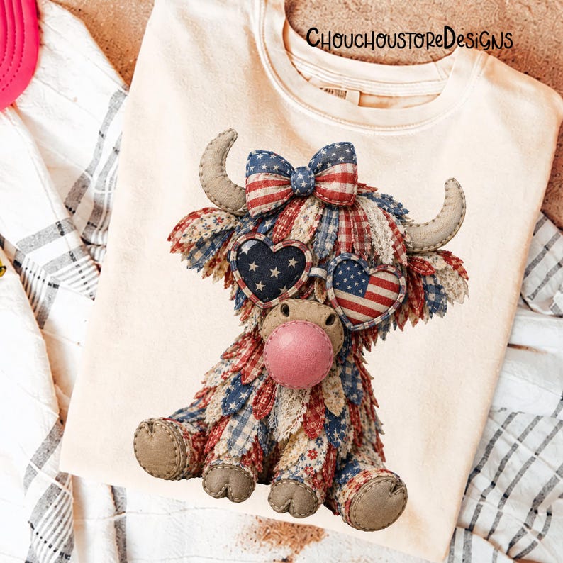 May include: Cream-colored t-shirt featuring a patriotic Highland cow design. The cow is adorned with a red, white, and blue patchwork pattern, heart-shaped sunglasses with American flag and star designs, and a bow. The text "ChouchoustoreDesigns" is printed on the shirt.