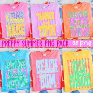 May include: A collection of six colorful t-shirts with summer-themed graphics. The shirts are pink, purple, orange, blue, coral, and yellow. Each shirt features a different phrase in a bold, playful font, such as "Ocean Babe" and "Hello Sunshine".