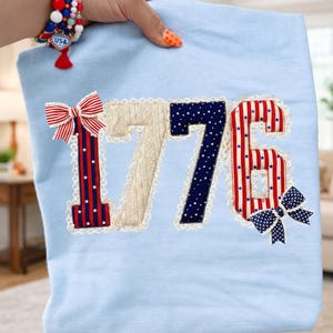 May include: A rustic wooden sign with the text "Welcome to our home" in white lettering. The sign features a distressed finish and a simple, inviting design, perfect for front door decor.