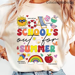 May include: Cream-colored t-shirt with a colorful graphic that reads "SCHOOL'S out for SUMMER." The design includes a sun, life preserver, beach chair, ice cream cone, rainbow, and apple. Text includes "Teacher Off Duty" and "Class Dismissed."