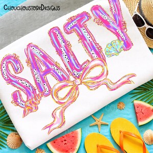 May include: White beach-themed design with the word "SALTY" in large, colorful letters. The letters are pink, blue, and gold, with a bow and seashell accents. The image includes a straw hat, sunglasses, watermelon slices, and flip-flops.