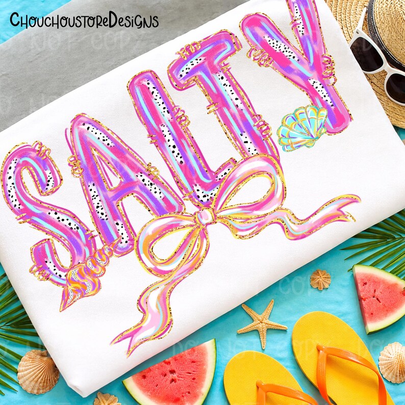 May include: White beach-themed design with the word "SALTY" in large, colorful letters. The letters are pink, blue, and gold, with a bow and seashell accents. The image includes a straw hat, sunglasses, watermelon slices, and flip-flops.