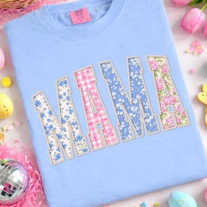 May include: A set of three ceramic mugs with a speckled, matte finish. The mugs are in shades of cream, light gray, and dark gray. Each mug has a simple, minimalist design, perfect for coffee or tea.