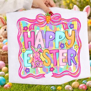 May include: White Easter-themed design with the words "HAPPY EASTER" in colorful bubble letters. A pink bunny and flowers are featured. The design is framed with a pink ribbon and carrot. The background has a pastel watercolor effect.