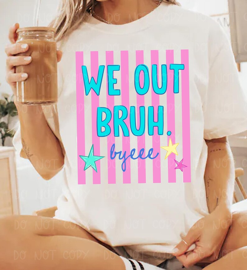 May include: Off-white t-shirt with the text "WE OUT BRUH. byeee" in blue and yellow, set against a pink and white striped background. The shirt features a crew neck and short sleeves.