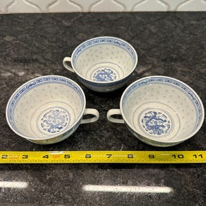 Vintage porcelain Teacup with  dragon design motif with rice eyes scattered circa mid 20th Century Jingdezhen