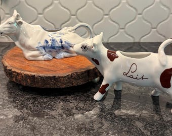 Vintage cow creamers - delft blue windmill cow lying down and French standing spotted cow Lait