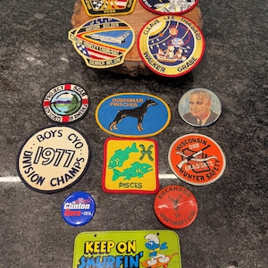 May include: A set of three ceramic mugs with a speckled, matte finish. The mugs are in shades of cream, light gray, and dark gray. Each mug has a simple, minimalist design, perfect for coffee or tea.