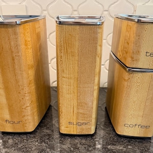 Vintage MCM set of 4 Lincoln Beautyware stacking canister set with a faux wood grain design - flour, tea, sugar & coffee