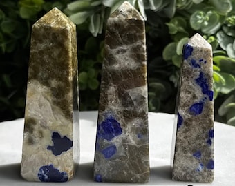 May include: Three different types of blue and green gemstone points labeled A, B, and C. The points are all about 3 inches tall and have a smooth, polished finish.