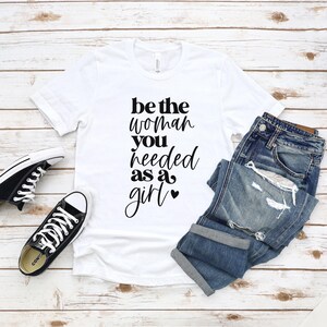 Be The Woman You Needed As A Girl Unisex Jersey Short Sleeve Tee