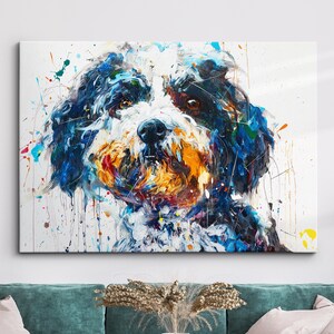 May include: A colorful abstract painting of a dog's face. The dog has white fur, black eyes, and a brown nose. The background is white with splashes of blue, yellow, and red paint.