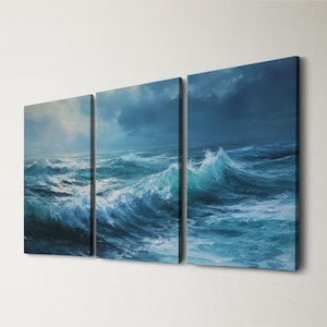 May include: A triptych canvas print showing a stormy sea. The artwork uses shades of blue and white, with crashing waves and a dramatic sky. The artwork is mounted on a white wall.