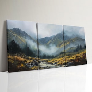 May include: A three-panel canvas print of a mountain scene. The artwork shows a river flowing through a valley, with mountains in the background. The color scheme includes green, yellow, and grey, with a misty atmosphere.