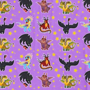 May include: A purple blanket featuring a repeating pattern of colorful cartoon dragons and yellow stars. The dragons are in various poses and colors, including black, red, blue, green, and brown. The blanket is made of a soft material.