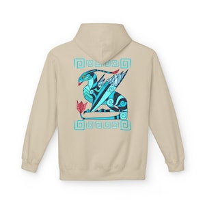 May include: A beige hoodie featuring a stylized dragon design on the back. The dragon is depicted in shades of blue, black, and red, with a geometric border. The hoodie has a hood and long sleeves.