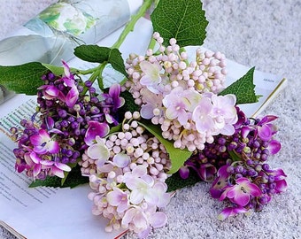 Four real touch hydrangea stems, two pink and two purple.