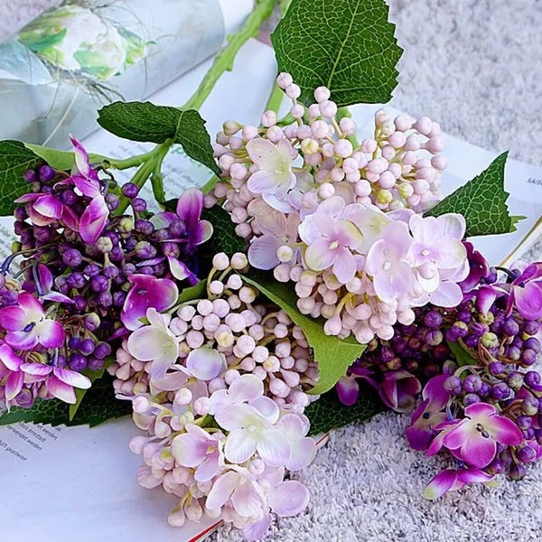 Four real touch hydrangea stems, two pink and two purple.