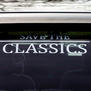 May include: A black car with a white sticker on the back window that says "Save the Classics".