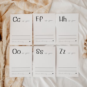 May include: Six white cards with black lettering. Each card features a letter of the alphabet, followed by "is for" and a blank line. The cards are arranged in two rows of three. The text on the cards reads: "Cc is for", "Ff is for", "Hh is for", "Oo is for", "Ss is for", and "Zz is for".