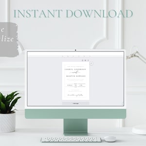 May include: A computer screen displaying a wedding invitation template with the text "Cheryl Anderson and Martin Howard" on a white background. The screen is on a white desk with a lamp and two potted plants.