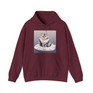 Cat sitting on a pillow B Unisex Heavy Blend™ Hooded Sweatshirt