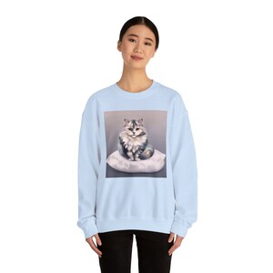 Cat sitting on a pillow B Unisex Heavy Blend™ Crewneck Sweatshirt